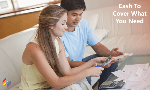 Couple looking at bills and calculating expenses together